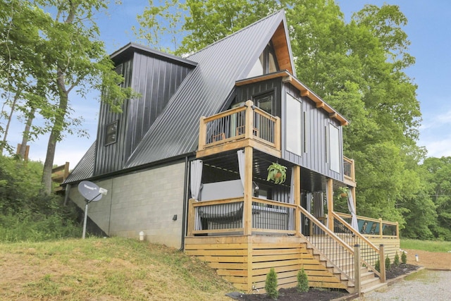 62579 Dunkle Creek Rd, Mcarthur, OH 45651 - exterior space featuring board and batten siding, metal roof, stairway, a balcony, and concrete block siding