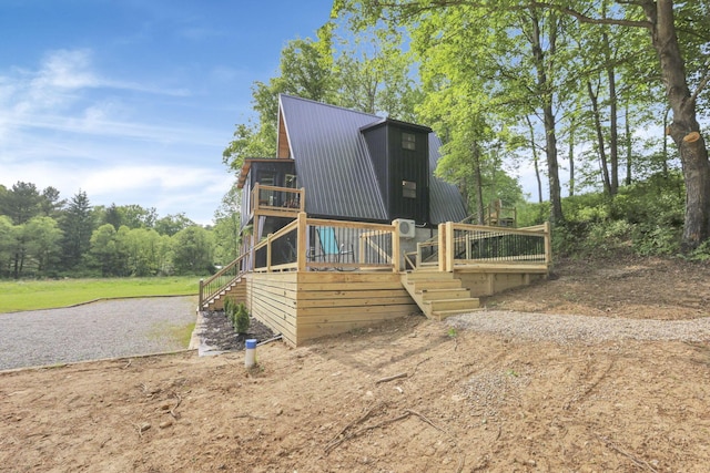 62579 Dunkle Creek Rd, Mcarthur, OH 45651 - view of property exterior with metal roof, stairs, and a wooden deck