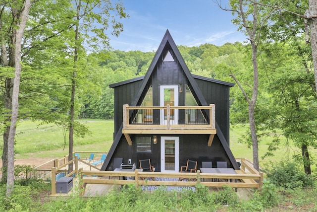 62579 Dunkle Creek Rd, Mcarthur, OH 45651 - rear view of house featuring a wooded view and a balcony