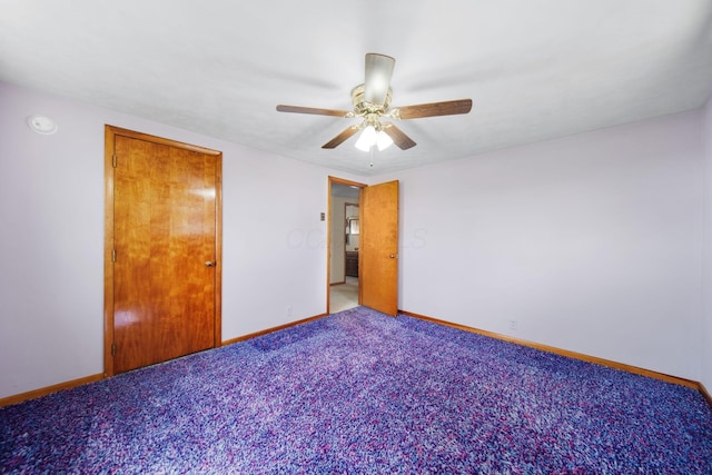 unfurnished bedroom featuring a ceiling fan, baseboards, and carpet