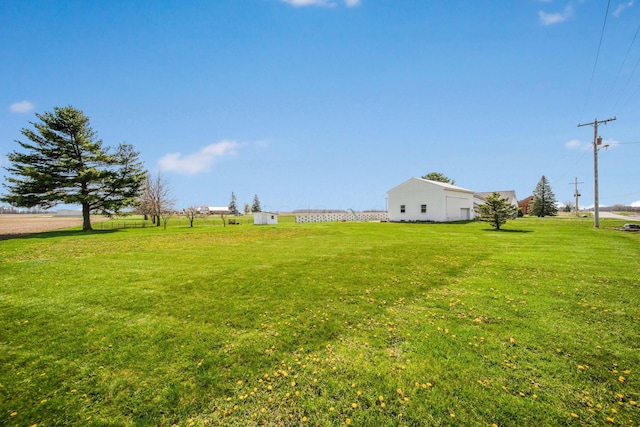 view of yard featuring an outbuilding and a pole building