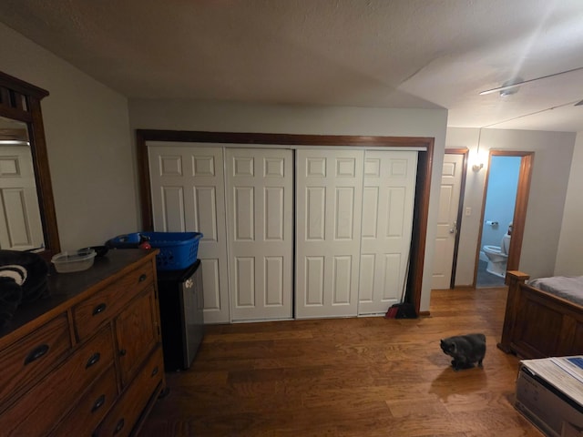 196 Whitethorne Ave, Columbus, OH 43223 - bedroom with dark wood finished floors, a closet, and ensuite bath