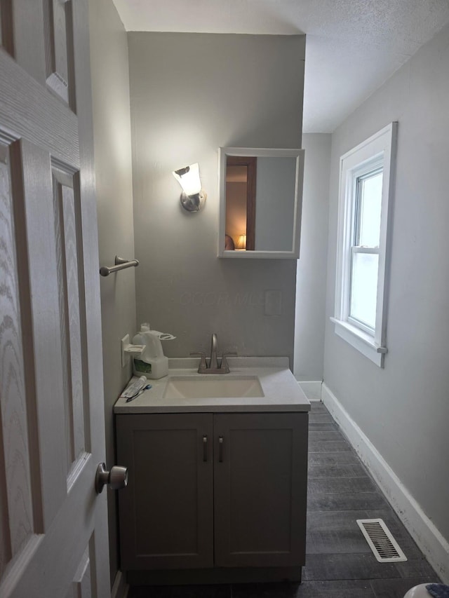 196 Whitethorne Ave, Columbus, OH 43223 - bathroom with vanity and wood finished floors