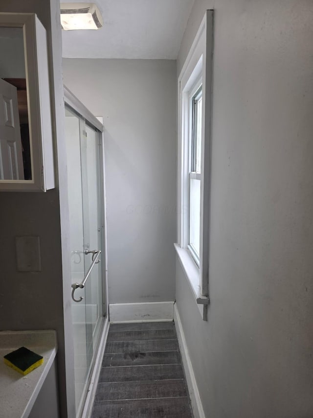 196 Whitethorne Ave, Columbus, OH 43223 - hall with baseboards and dark wood finished floors