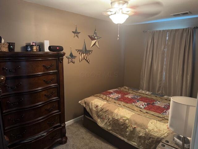 1031 S Washington St, Circleville, OH 43113 - carpeted bedroom with ceiling fan