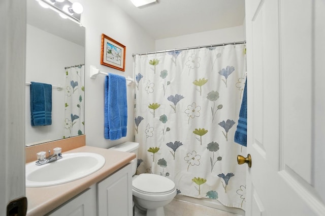 full bath featuring vanity, a shower with shower curtain, tile patterned flooring, and toilet