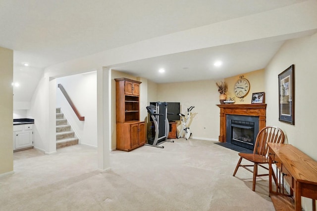 home office featuring a fireplace with flush hearth, baseboards, recessed lighting, and light colored carpet