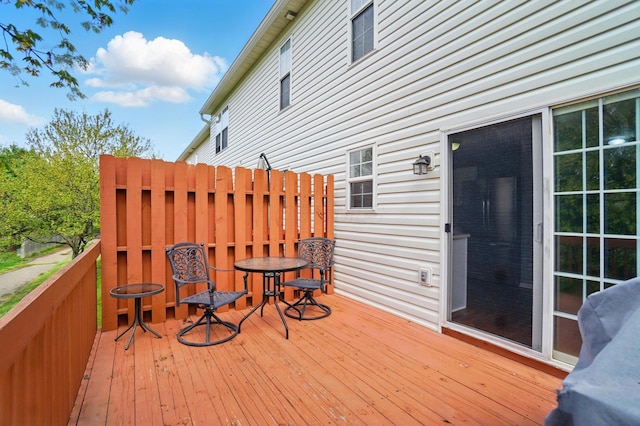 wooden deck with outdoor dining area