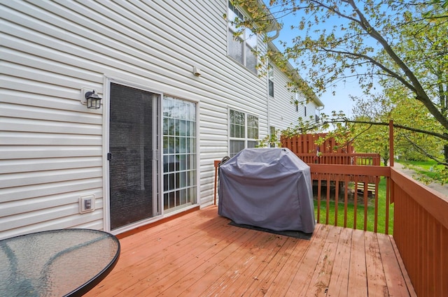 wooden terrace featuring area for grilling