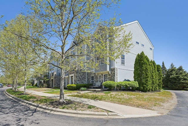 view of home's exterior featuring stone siding