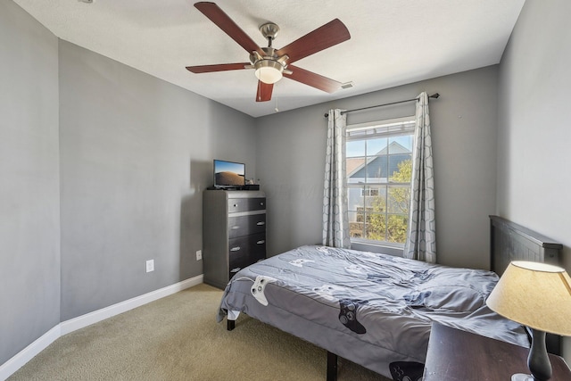 bedroom featuring carpet flooring, a ceiling fan, and baseboards