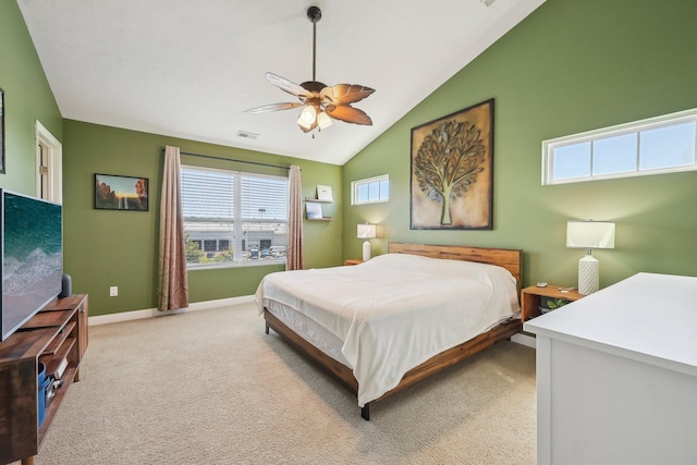 bedroom featuring visible vents, lofted ceiling, light carpet, baseboards, and ceiling fan