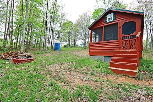 view of yard with a sunroom