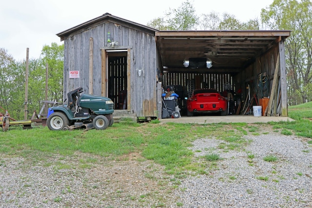 view of outbuilding featuring an outbuilding and a carport