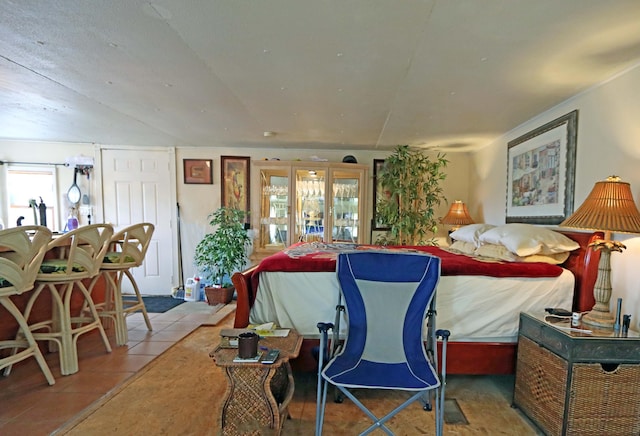 tiled bedroom featuring french doors