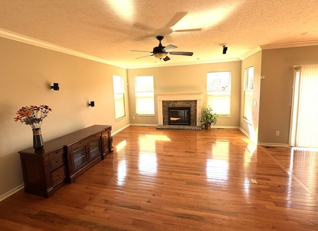unfurnished living room with crown molding and hardwood / wood-style flooring