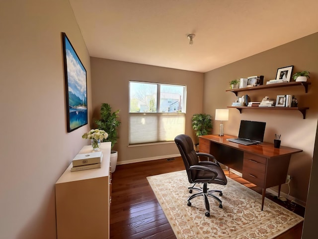 home office featuring dark wood-type flooring and baseboards