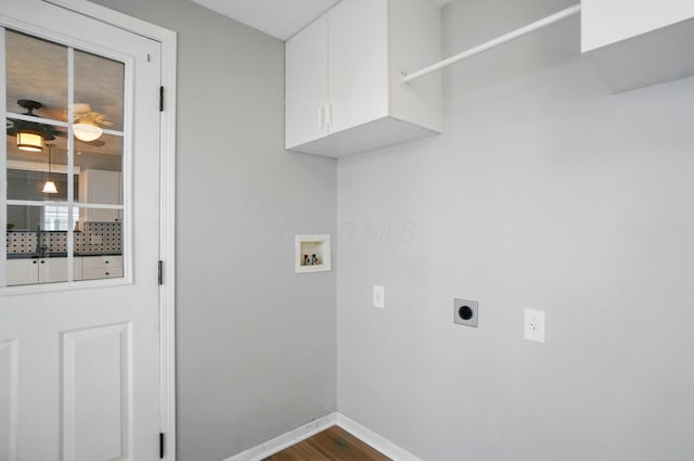 clothes washing area with hookup for an electric dryer, dark wood-style flooring, baseboards, washer hookup, and cabinet space