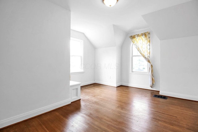 461 E N Broadway St, Columbus, OH 43214 - additional living space featuring lofted ceiling, wood finished floors, and baseboards