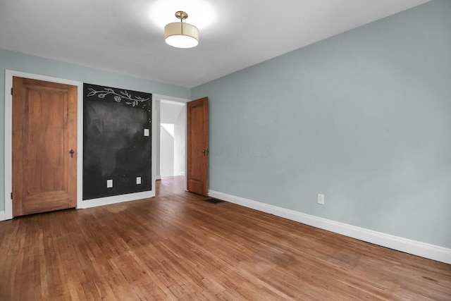 461 E N Broadway St, Columbus, OH 43214 - unfurnished bedroom featuring baseboards and wood finished floors