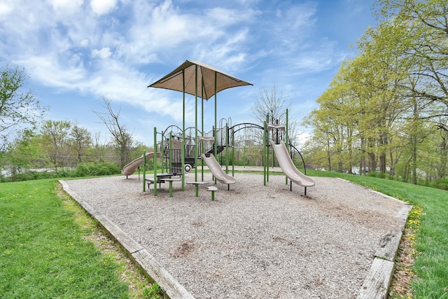 community jungle gym featuring a lawn