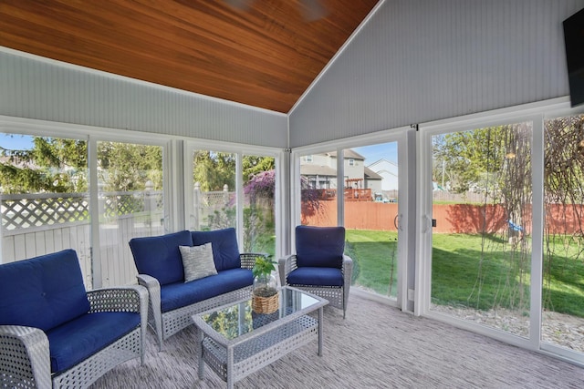 sunroom / solarium featuring a wealth of natural light and an outdoor living space
