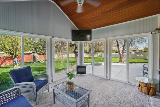 sunroom / solarium with a ceiling fan