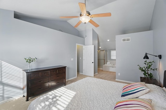 bedroom featuring high vaulted ceiling, light carpet, baseboards, ensuite bath, and visible vents