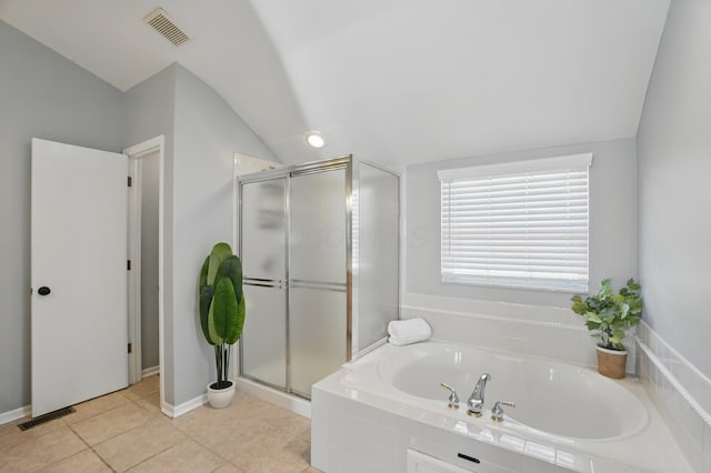 bathroom featuring a bath, vaulted ceiling, visible vents, and a stall shower