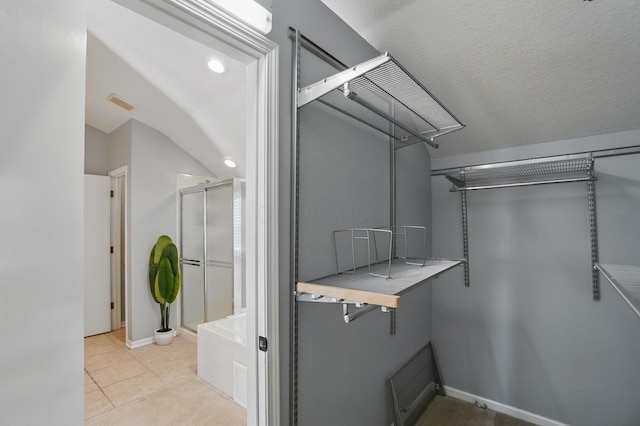 walk in closet with visible vents and light tile patterned floors