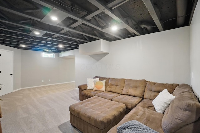 living area featuring carpet floors and baseboards