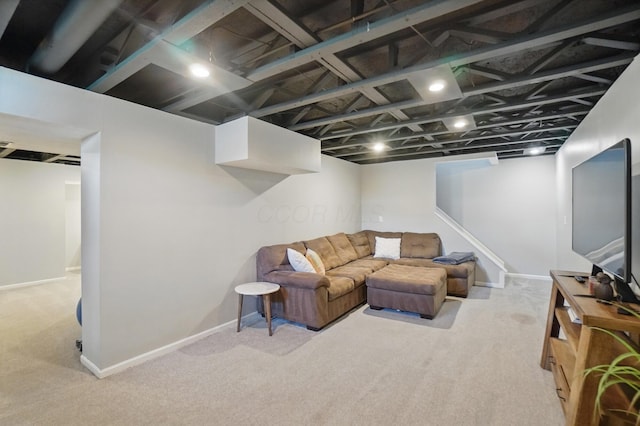 living room with carpet floors, baseboards, and stairway
