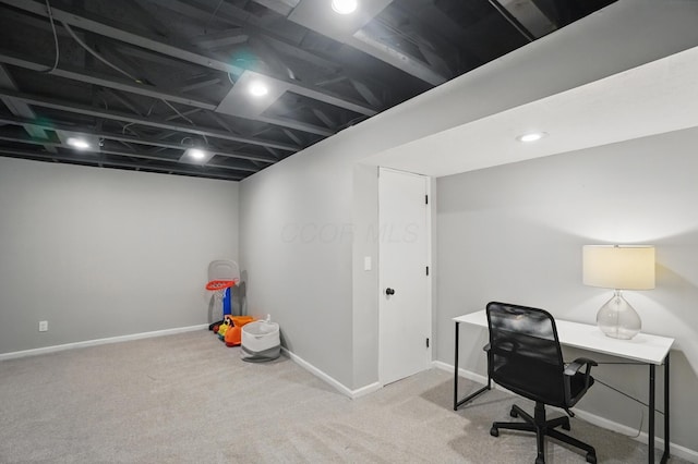 carpeted office space featuring baseboards
