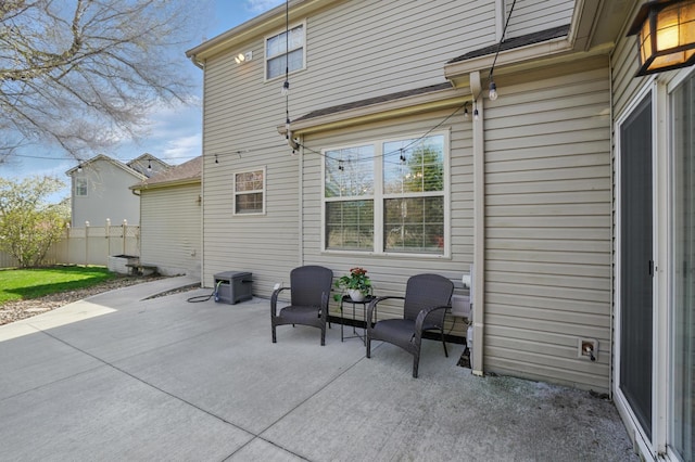 back of house with a patio area and fence