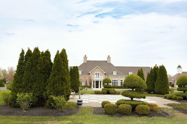 view of front of home with a balcony