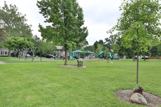 surrounding community with a lawn and playground community