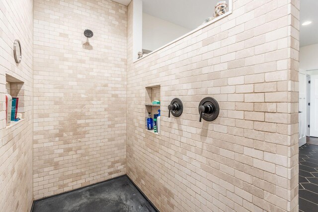 bathroom featuring tiled shower