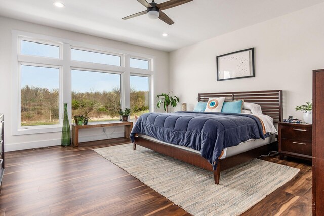 bedroom featuring a ceiling fan, wood finished floors, and recessed lighting