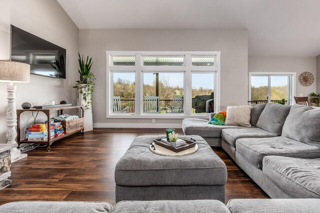 living area featuring wood finished floors and baseboards