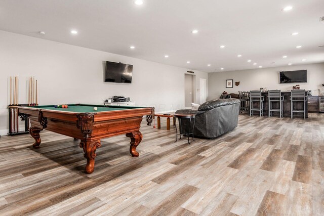 recreation room featuring light wood-style flooring, bar area, recessed lighting, and billiards