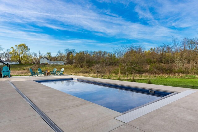 pool with a patio area