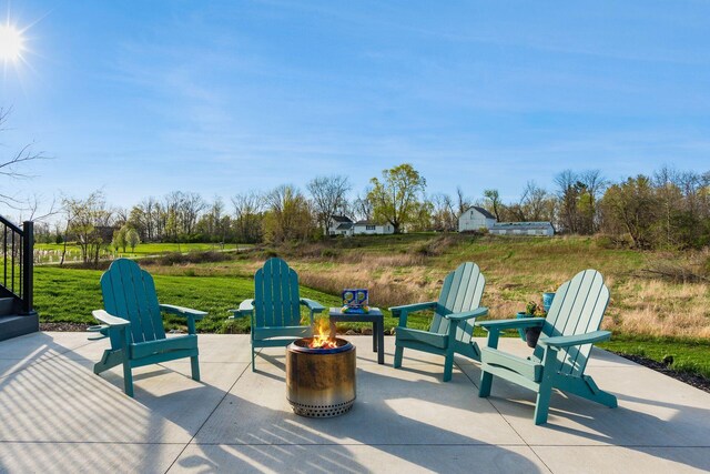 view of patio / terrace with a fire pit