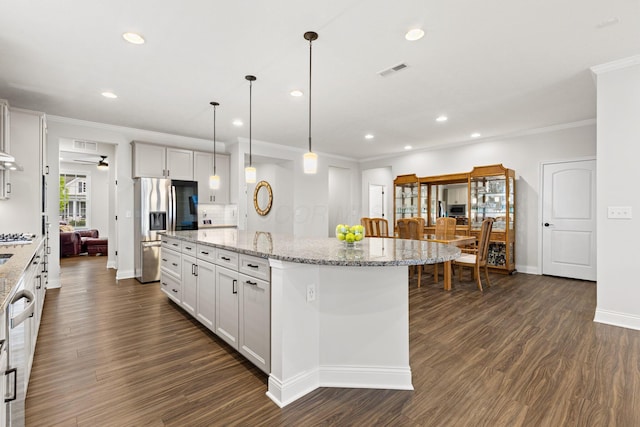kitchen featuring visible vents, crown molding, appliances with stainless steel finishes, and recessed lighting