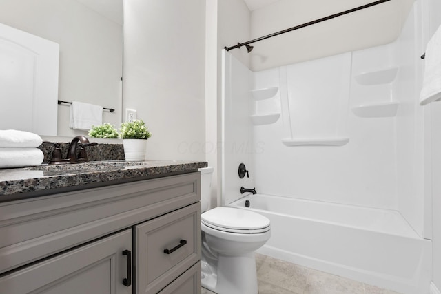 full bath with vanity, toilet, and bathing tub / shower combination