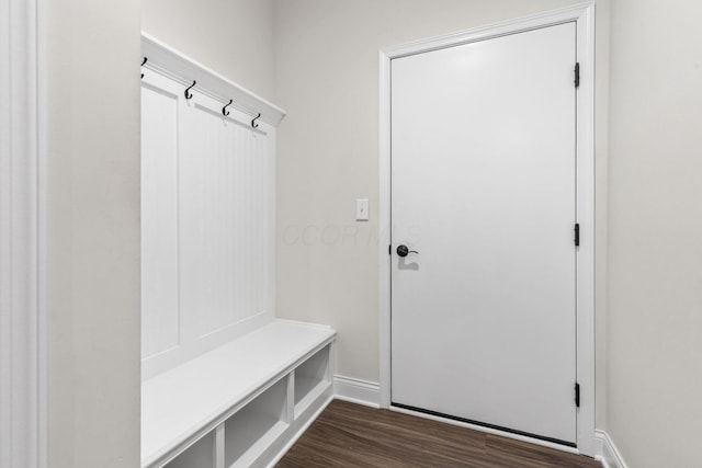 mudroom with baseboards and dark wood finished floors