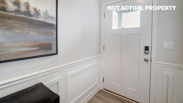 6357 Darby Plains St, Columbus, OH 43228 - entryway with a decorative wall and light wood-style flooring
