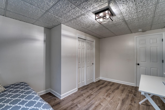 779 Millstone Ln, Mount Vernon, OH 43050 - unfurnished bedroom with baseboards, wood finished floors, a closet, and an ornate ceiling