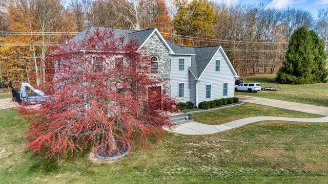 779 Millstone Ln, Mount Vernon, OH 43050 - view of property exterior with a lawn and roof with shingles