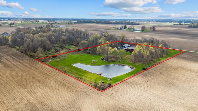 drone / aerial view featuring a water view and a rural view