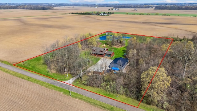birds eye view of property featuring a rural view